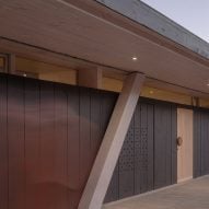 Columns supporting black clad house