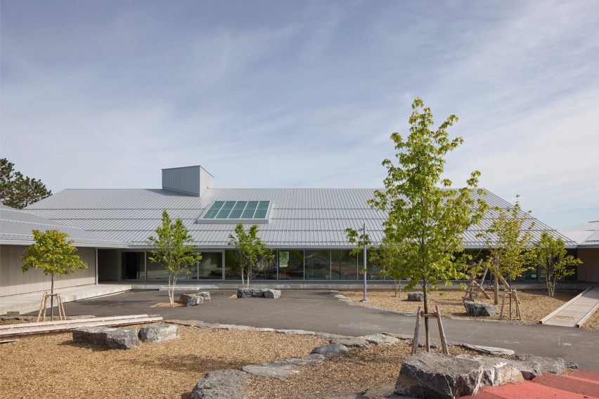 School building with light coloured siding