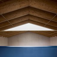 A blue balcony and wooden ceiling