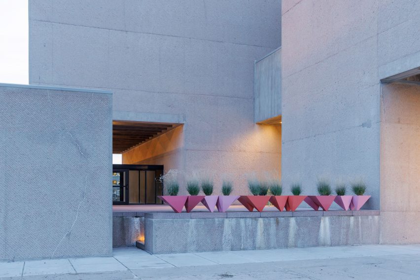 Concrete bench with planters on it