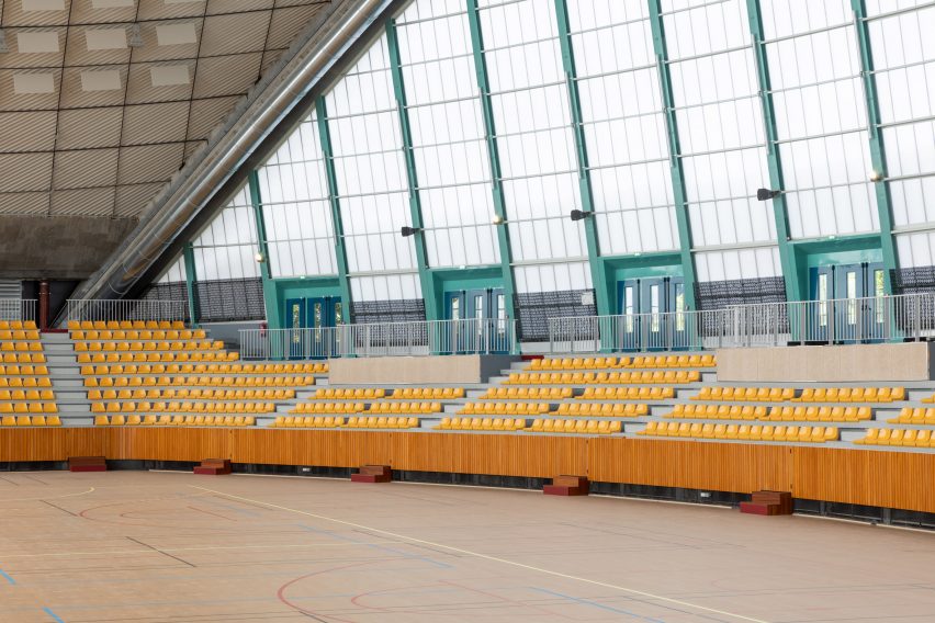 Yellow seats inside Grande Nef of the Île-des-Vannes by Chatillon Architectes