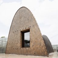 Shingles cloak roof of Green Ark pavilion in Belgian botanic garden