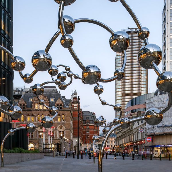 Yayoi Kusama installs mirrored spheres in front of a London subway station