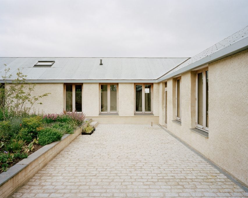 Courtyard within home by Hugh Strange Architects