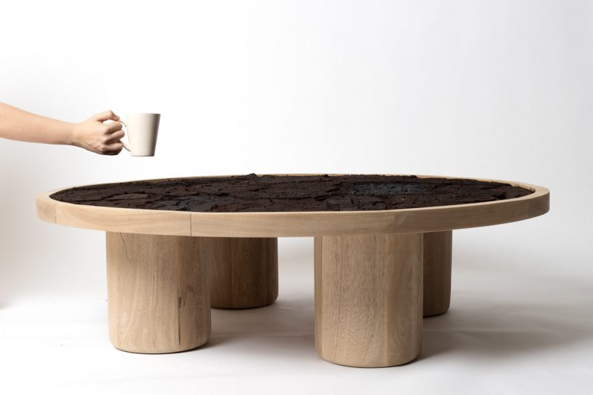 A photograph of a coffee table in tones of brown, against a white backdrop.