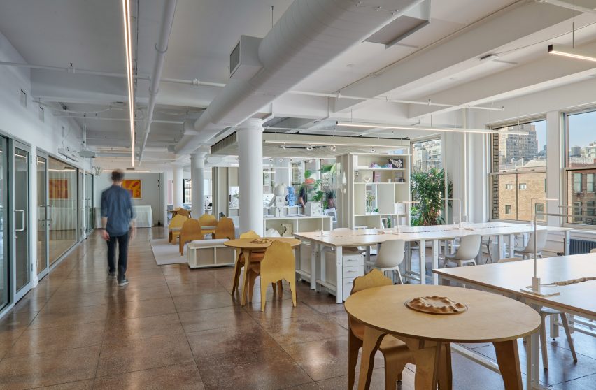 Open workspace furnished with long desks