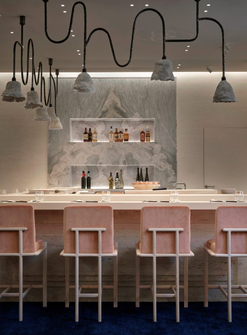 Table with pink chairs in Monaco restaurant