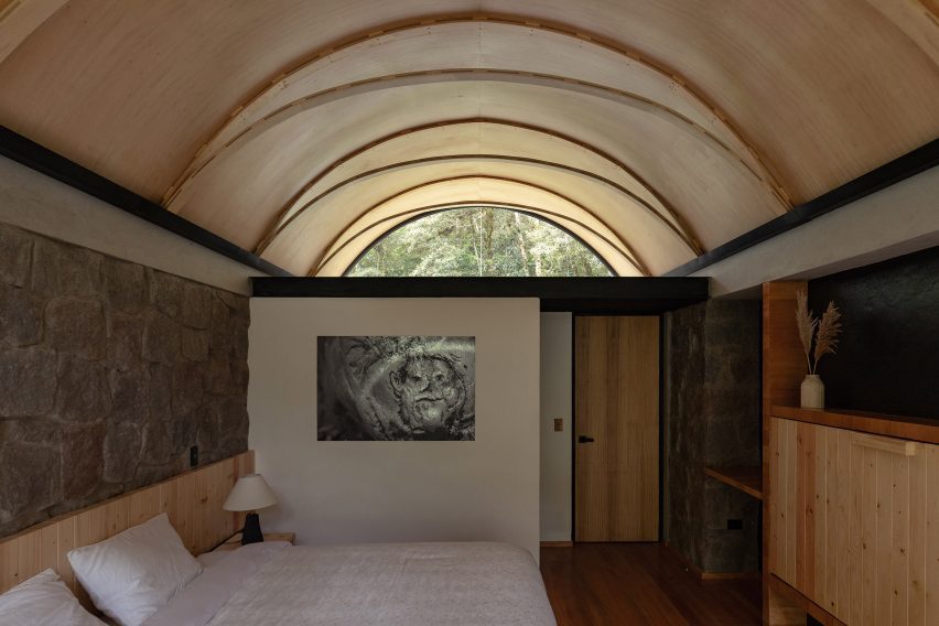 A bed in a barrel vault structure