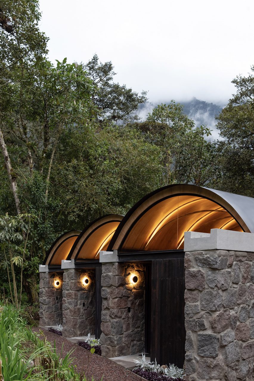 A series of stone buildings in jungle