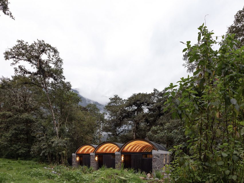 A series of stone buildings in jungle