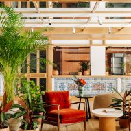 Bright orange chair and oversized pots