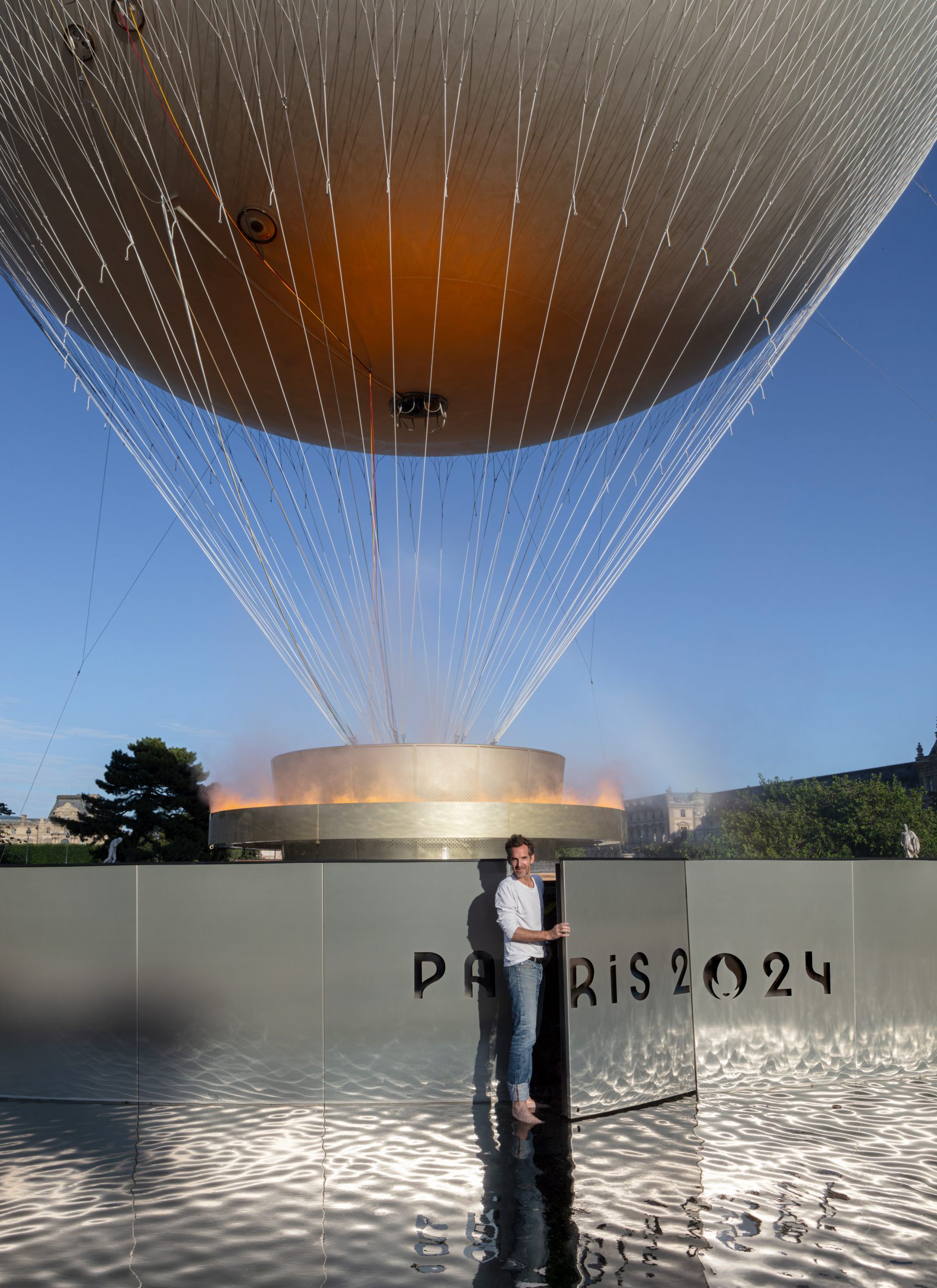 Designer Mathieu Lehanneur in front of Olympic balloon