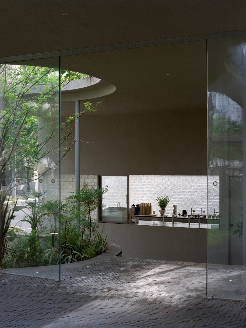 View of brick-paved cafe by Offhand Practice