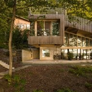 Lemay creates mass-timber chalet with sloped green roof in Quebec