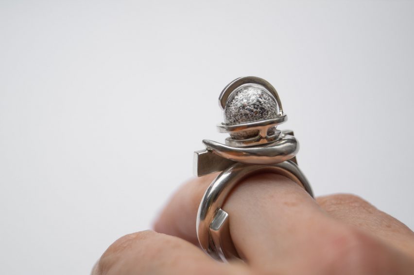 Close-up photo of an elaborate ring by Karoline Healy and H2ERG on someone's hand