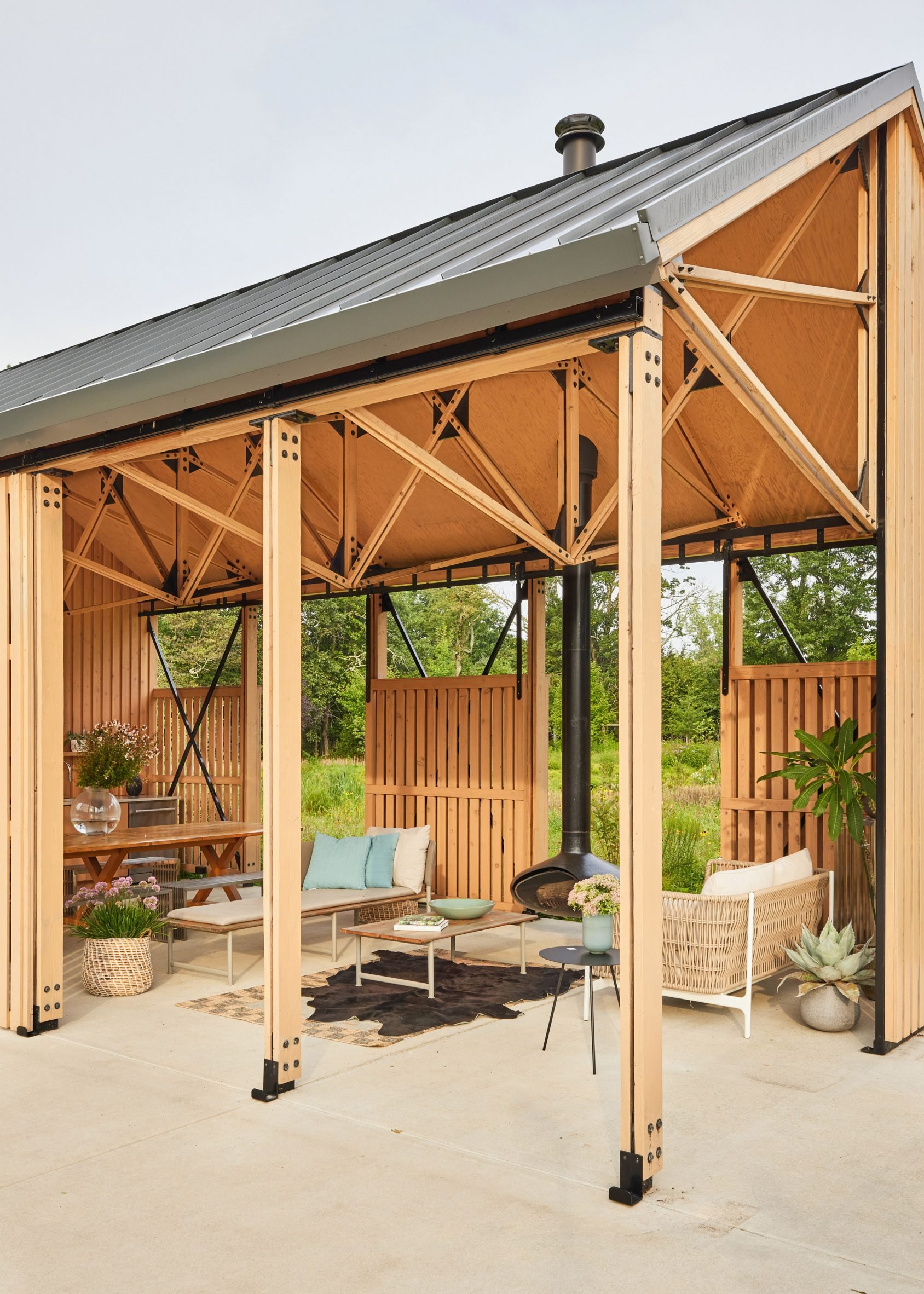 View looking into the pool house, revealing the truss system under the roof