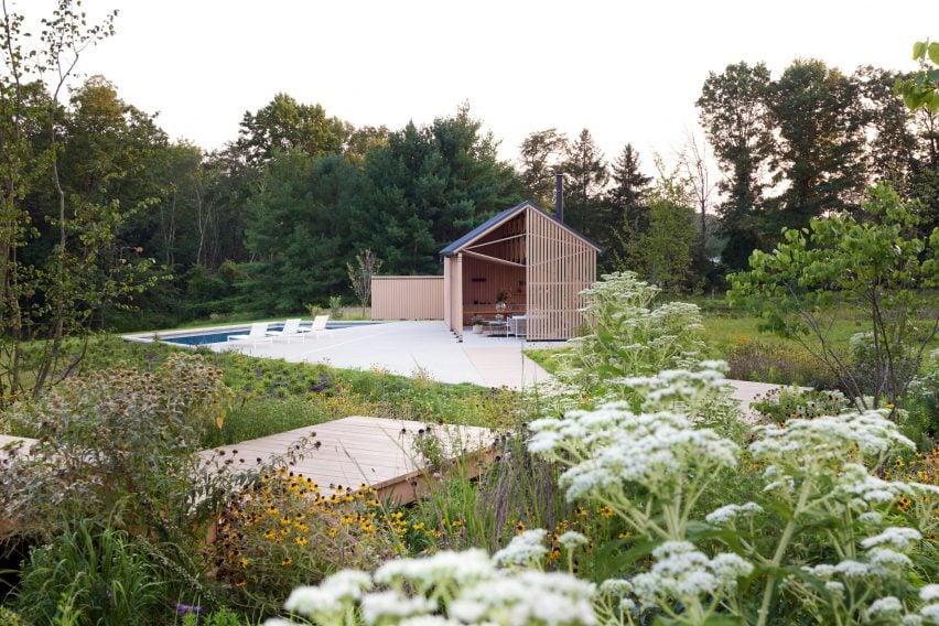 Pool house as seen from a meadow