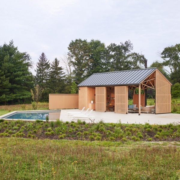 Osso Architecture models timber pool house in New Jersey on horse arena