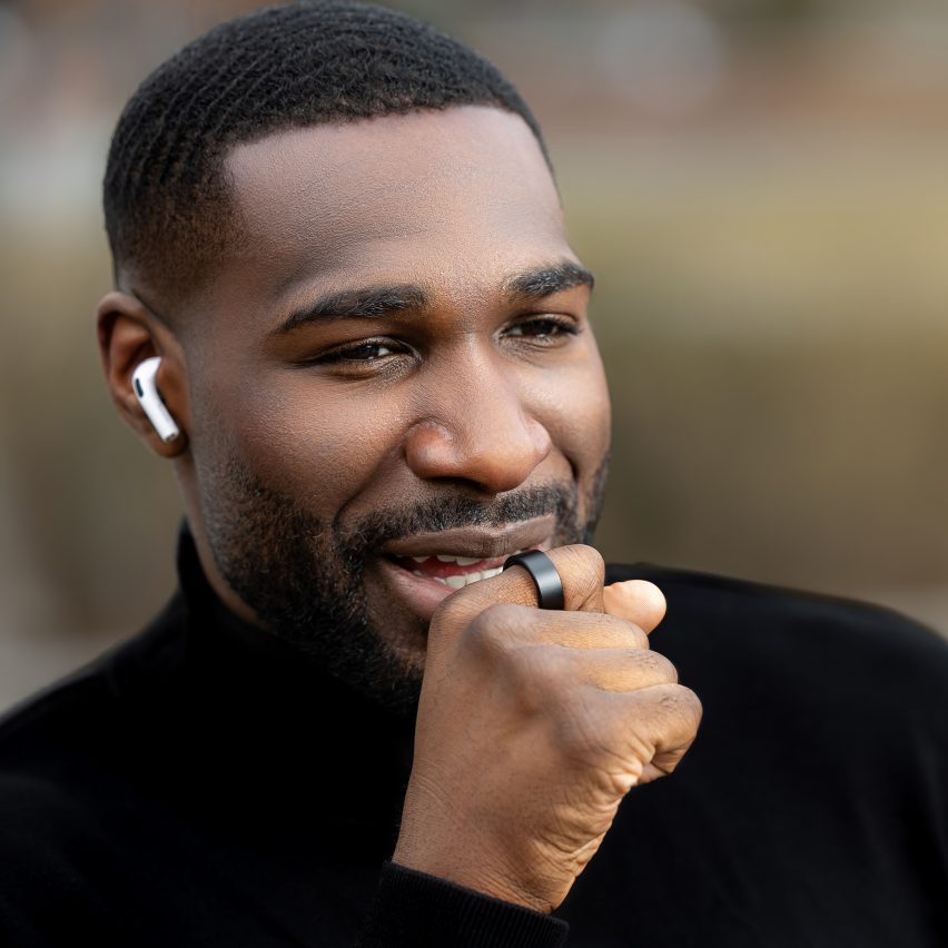 Photo of a man speaking into a Wizpr ring