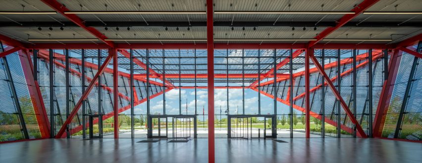 Glass and red steel building interior