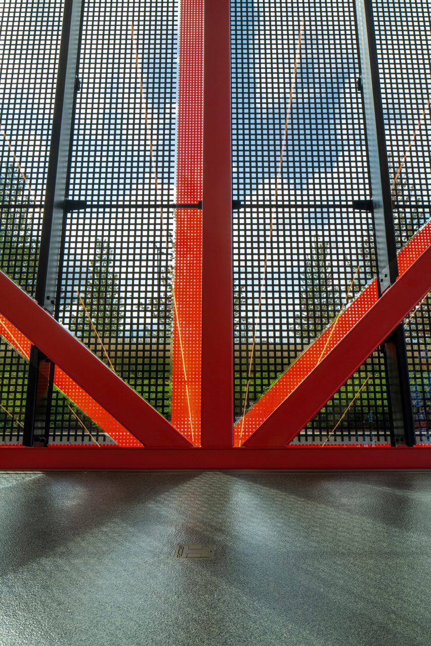 Red trusses with heavily fritted glass