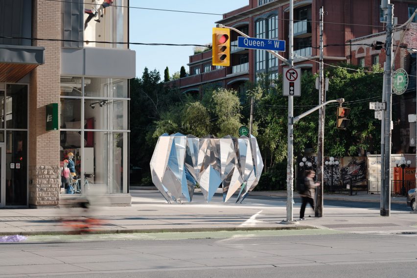 Shiny sculpture on street corner