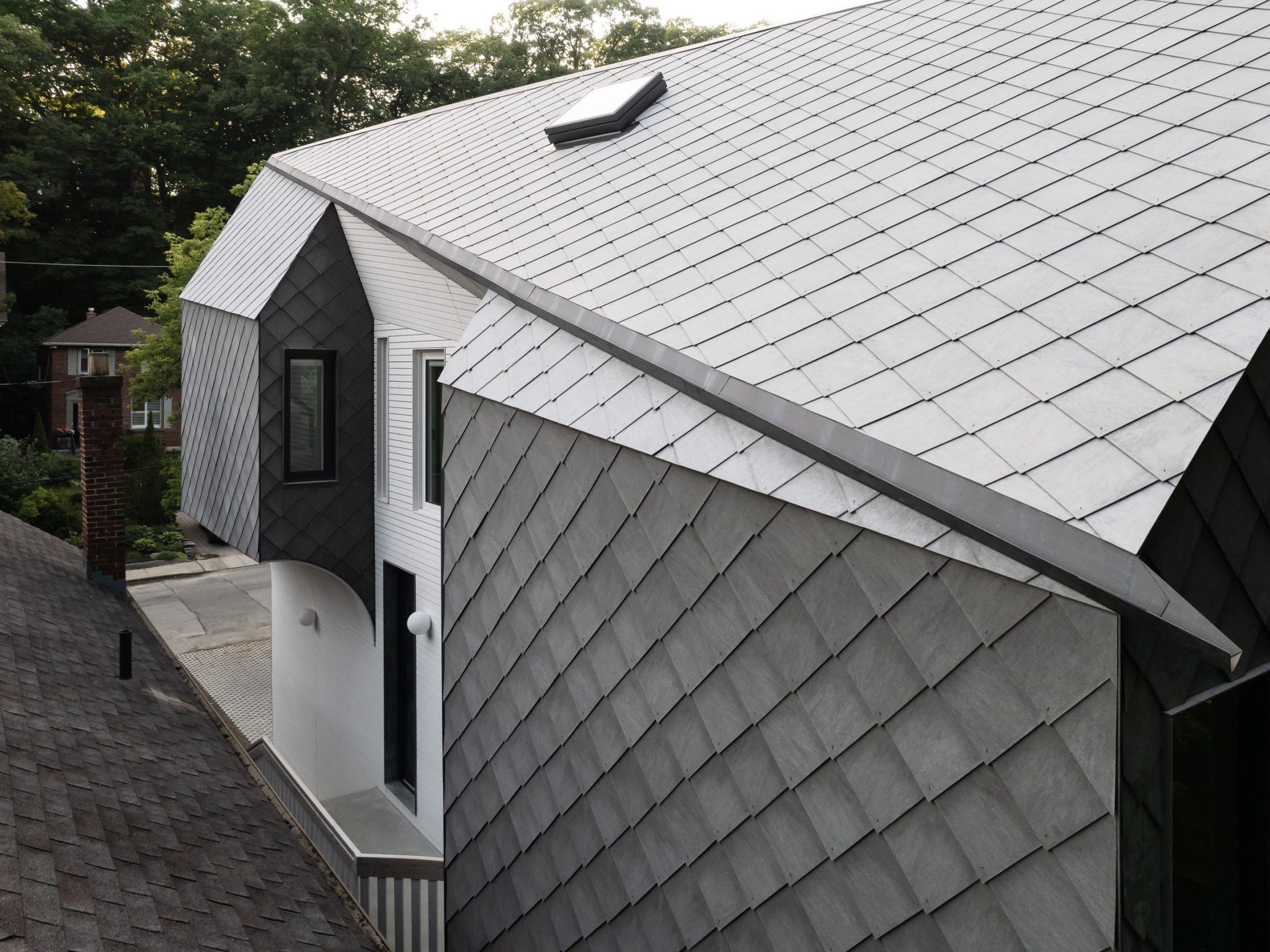 Reigo and Bauer uses diamond-shaped cladding for angular Toronto house ...