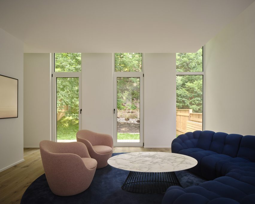 Living room with curved blue sofa