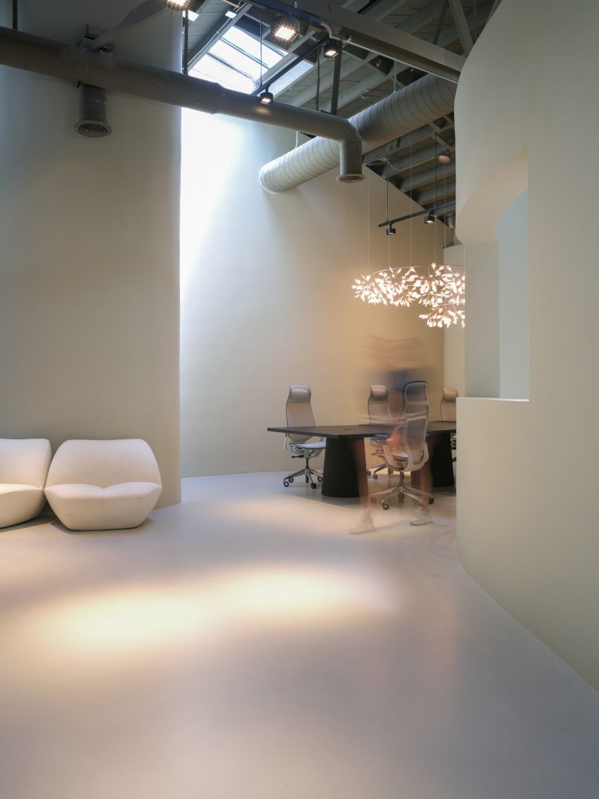 It features minimalist interior design including Moooi furniture