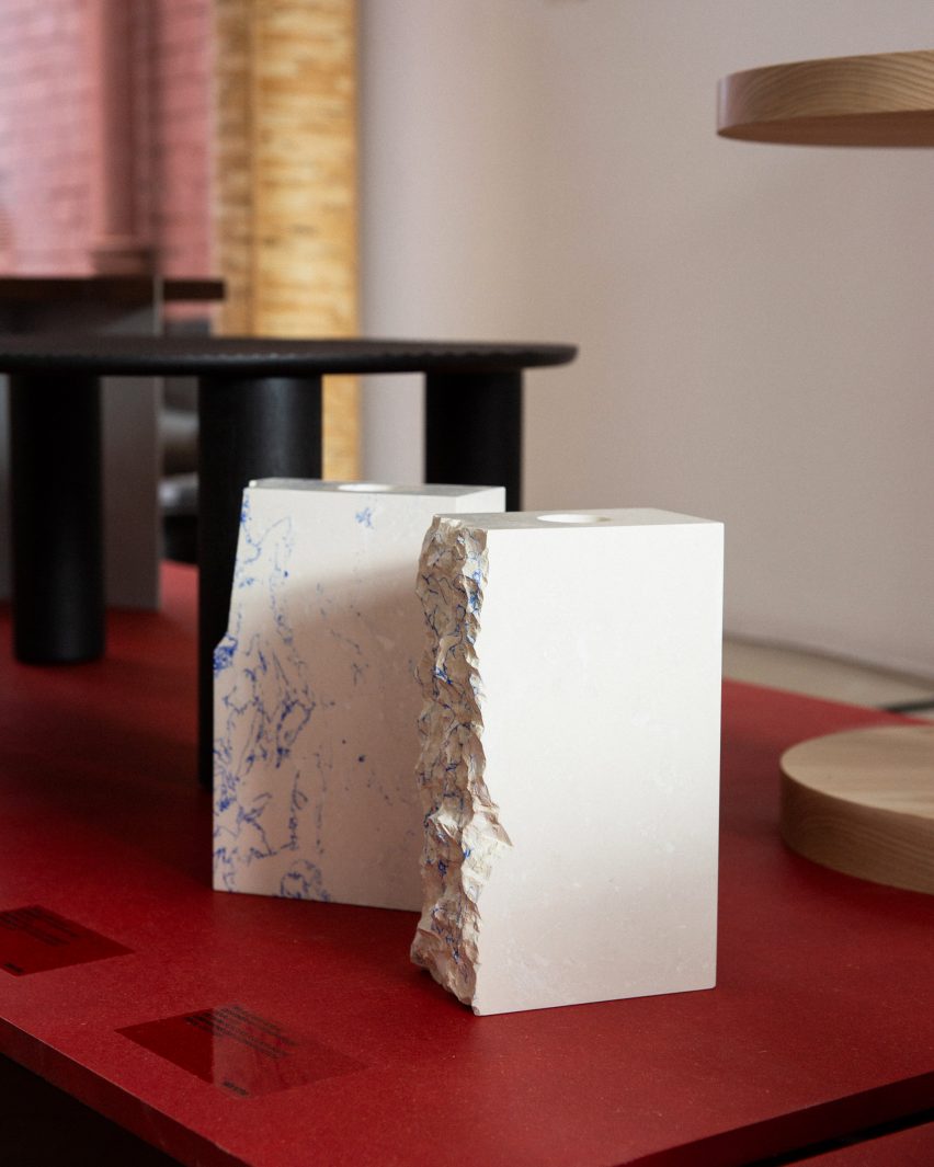 A photograph of two white rectangular vases, on display in the Under One roof exhibition.