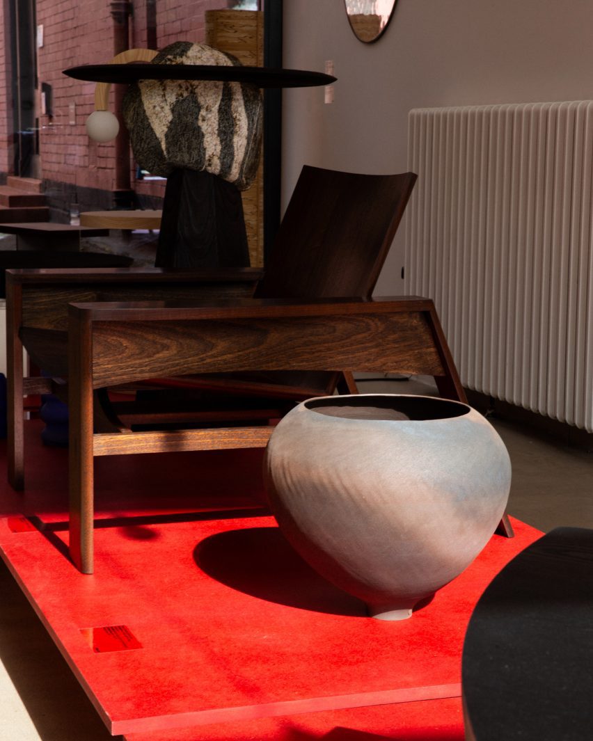 Nicholas Davis's Fireside Chair and a wooden vase