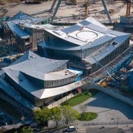 BIG tops waterfront art museum in Suzhou with swooping roof planes