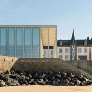 Slim concrete colonnade fronts D-Day Museum in Normandy