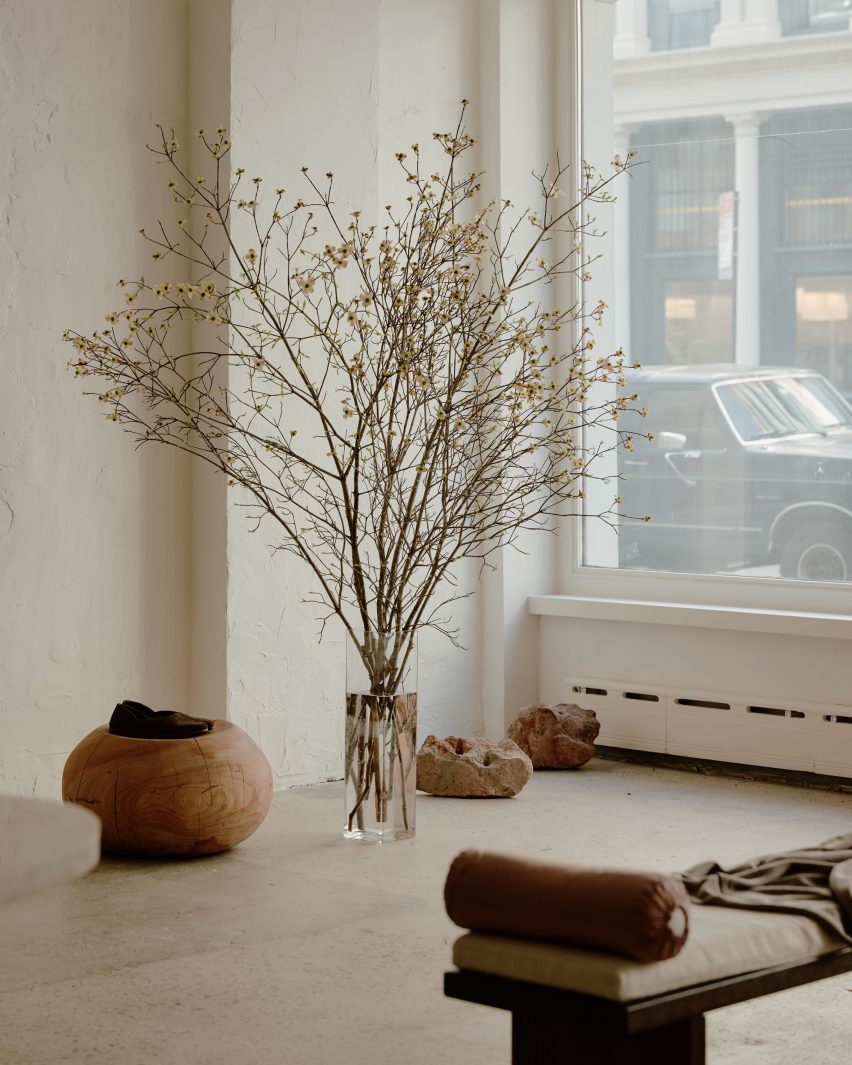 A store with a large planter and furniture