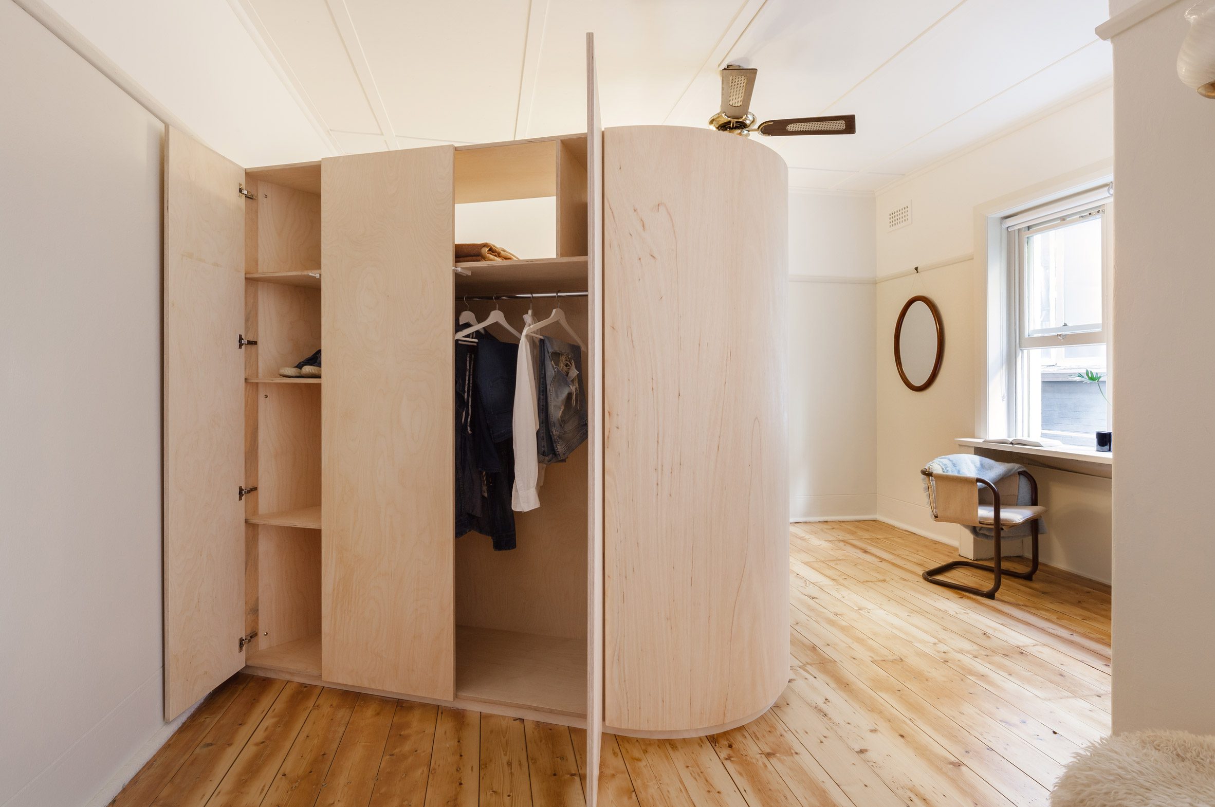 Bedroom divided by storage solution