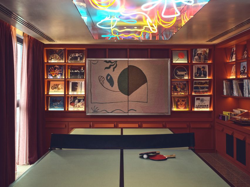 Vinyl listening room decorated by a neon ceiling light