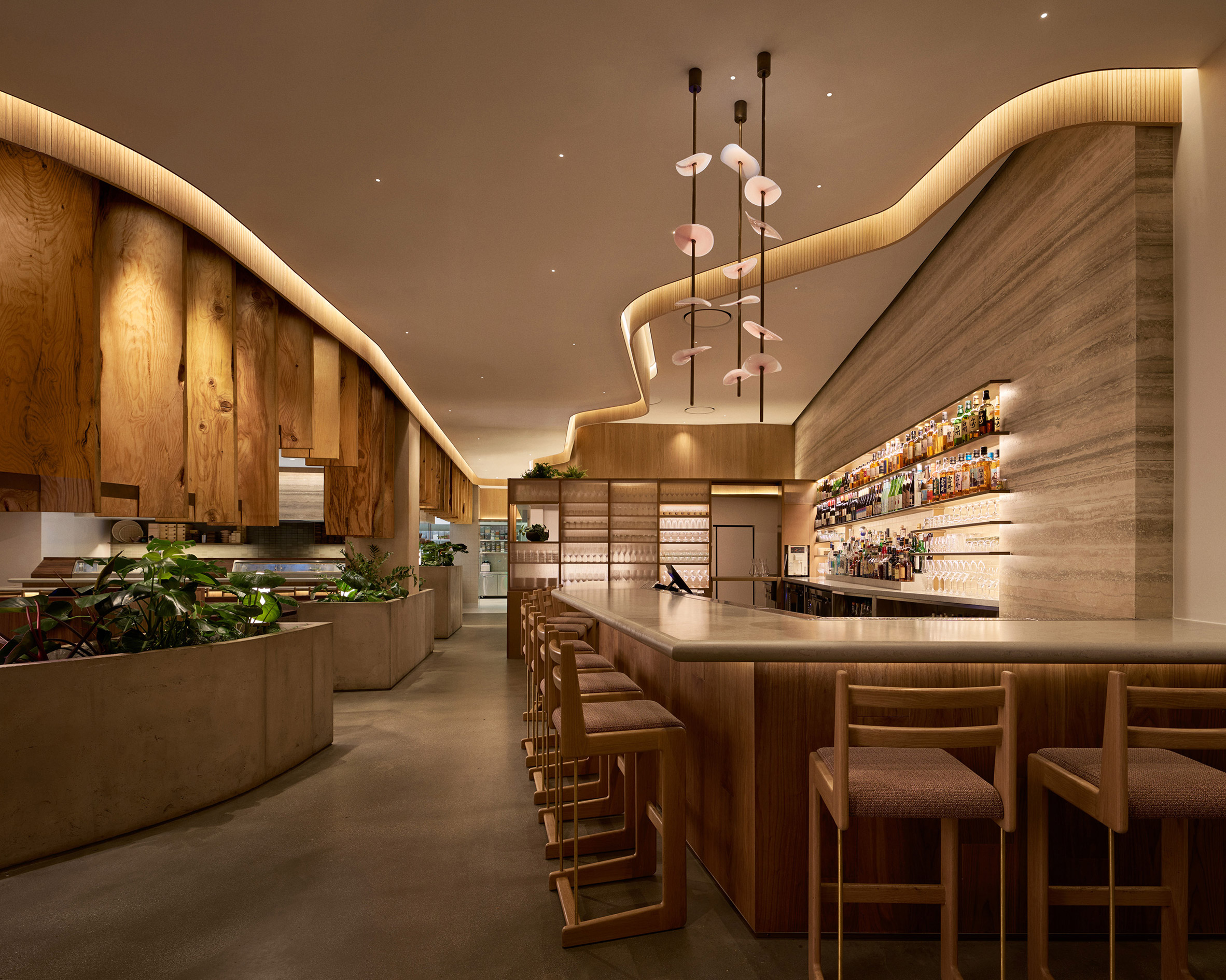 Sculptural light fixture above a bar counter