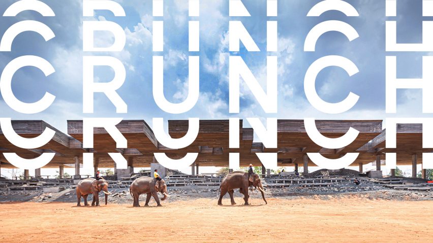 A photograph of elephants walking on brown sand terrain, with a blue sky above, and distorted white text that reads 'crunch' overlaid on the photograph.