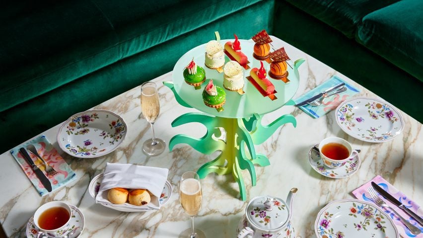 Photograph of the afternoon tea table layout, including Lim's colourful sculptural stands with floral crockery.