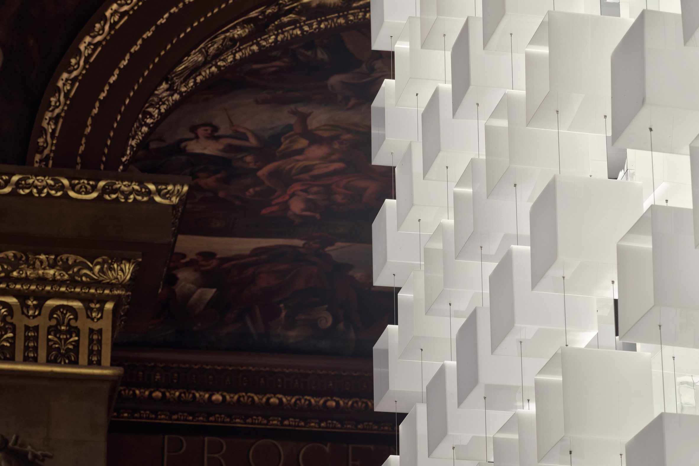 Painted Hall ceiling contrasting with Melek installation