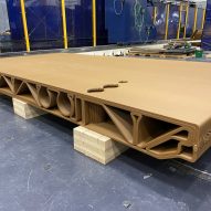 Wood waste and bioplastic floor panel boasts the strength of steel