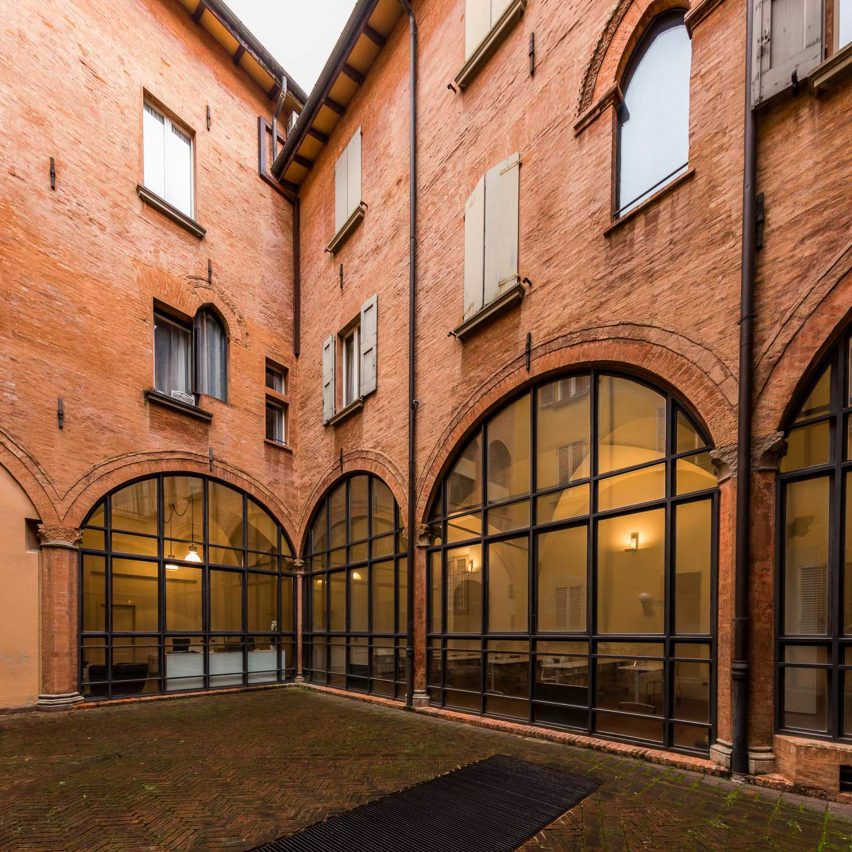 Photograph of a building with three large arched windows.