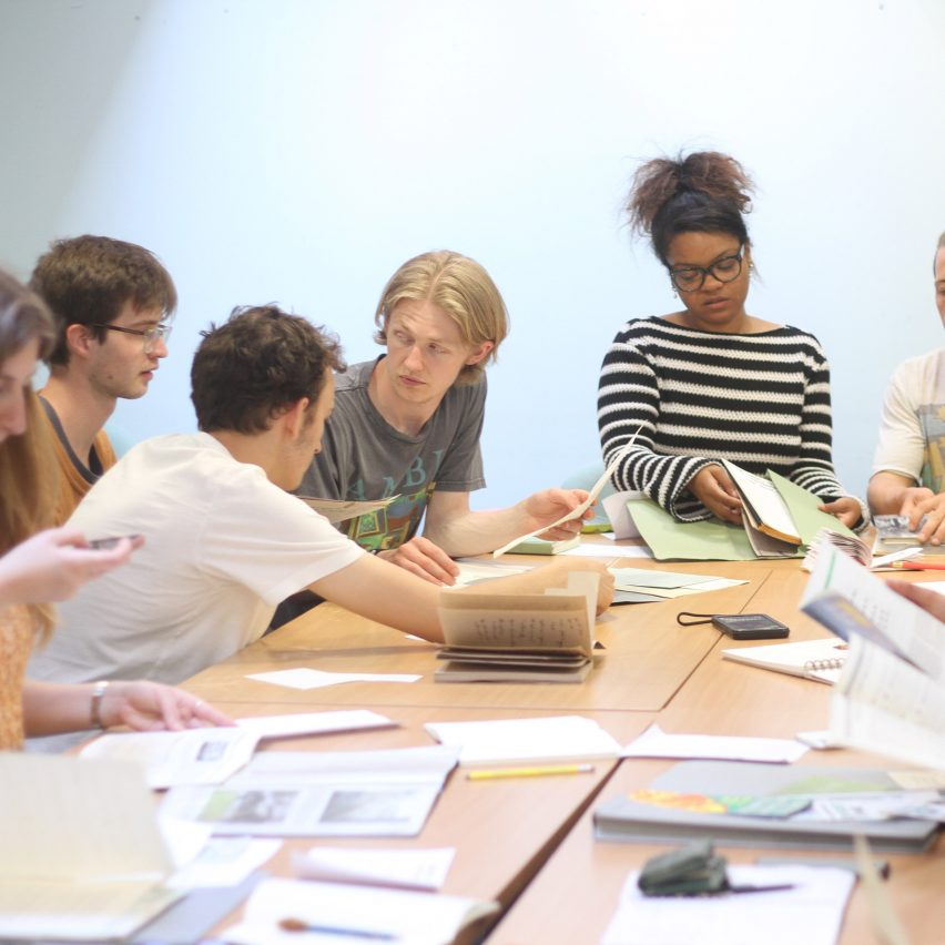 a group of students around a desk