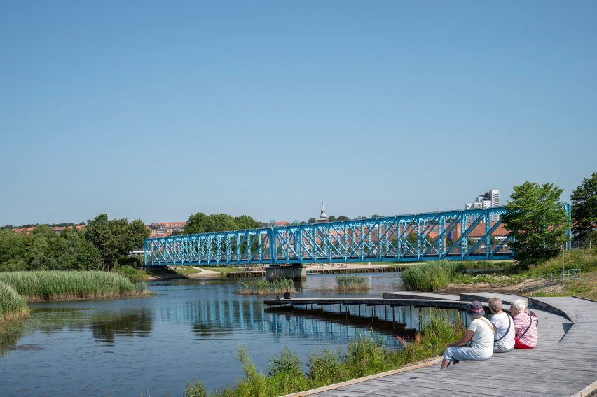 Boardwalk beside river bank in Randers by CF Møller