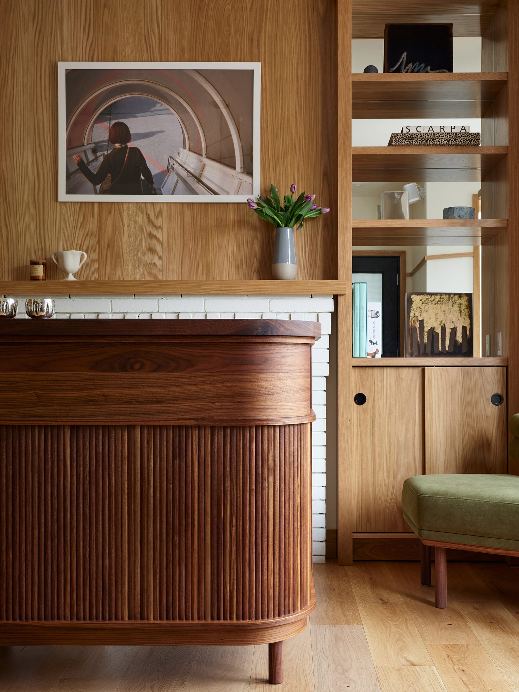 Compact walnut desk featuring a fluted front and curved corners