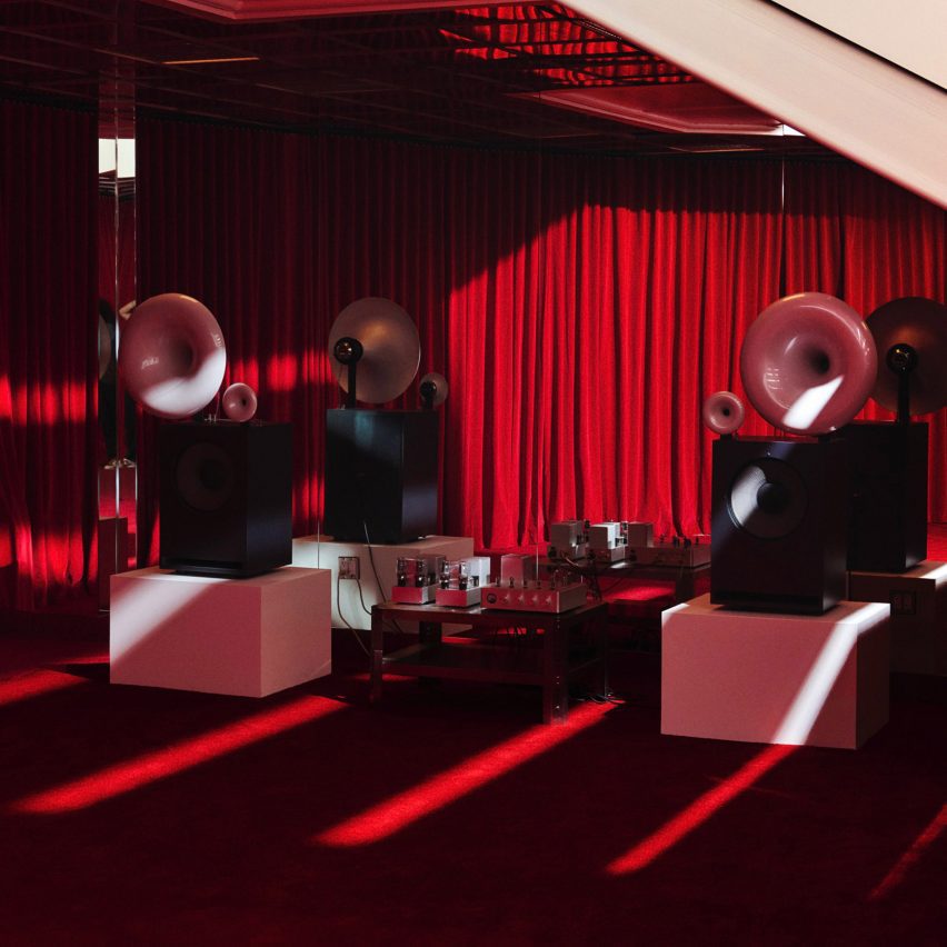 Speakers in red room