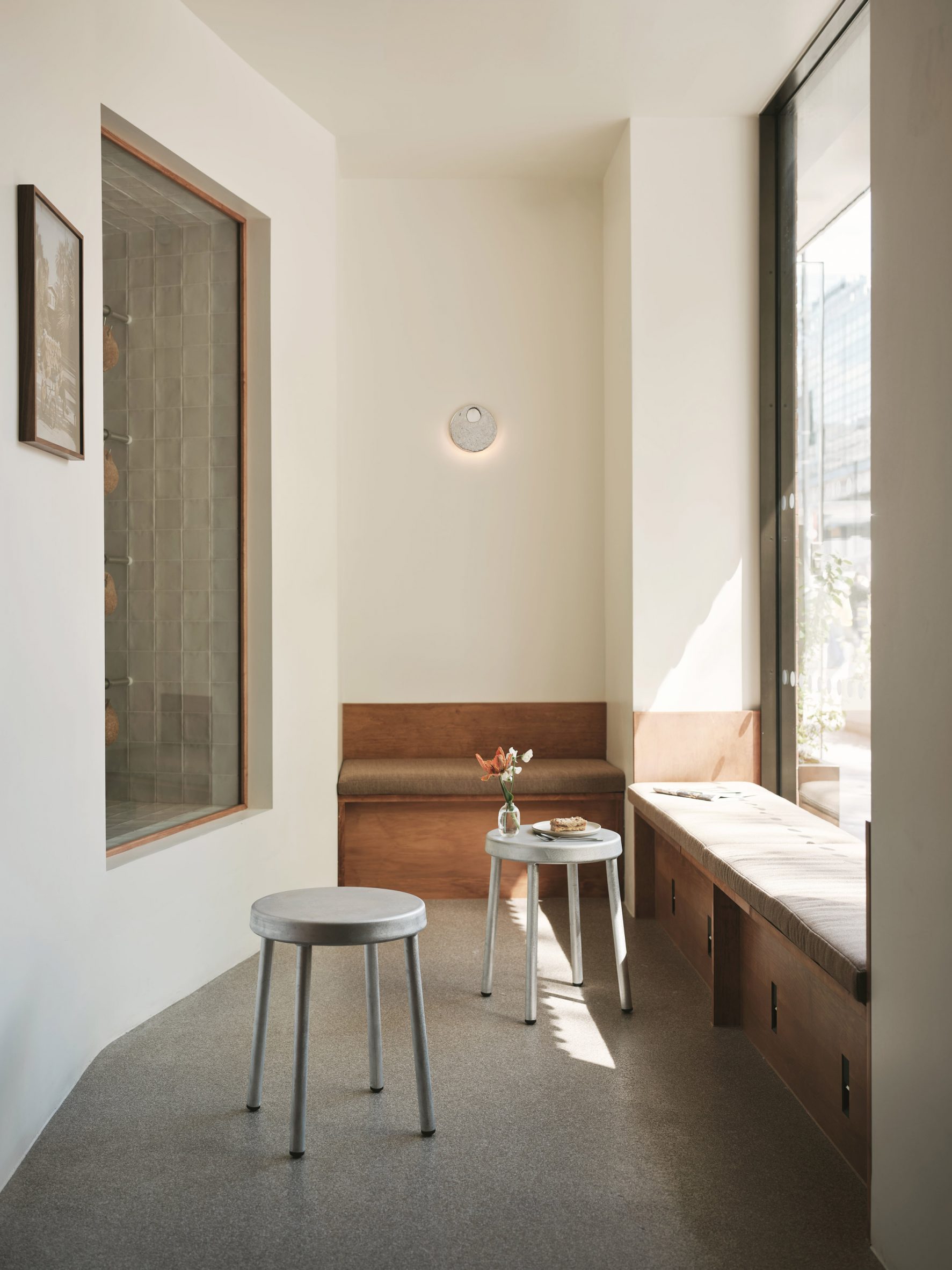 White-painted room with bench seating built under the windows