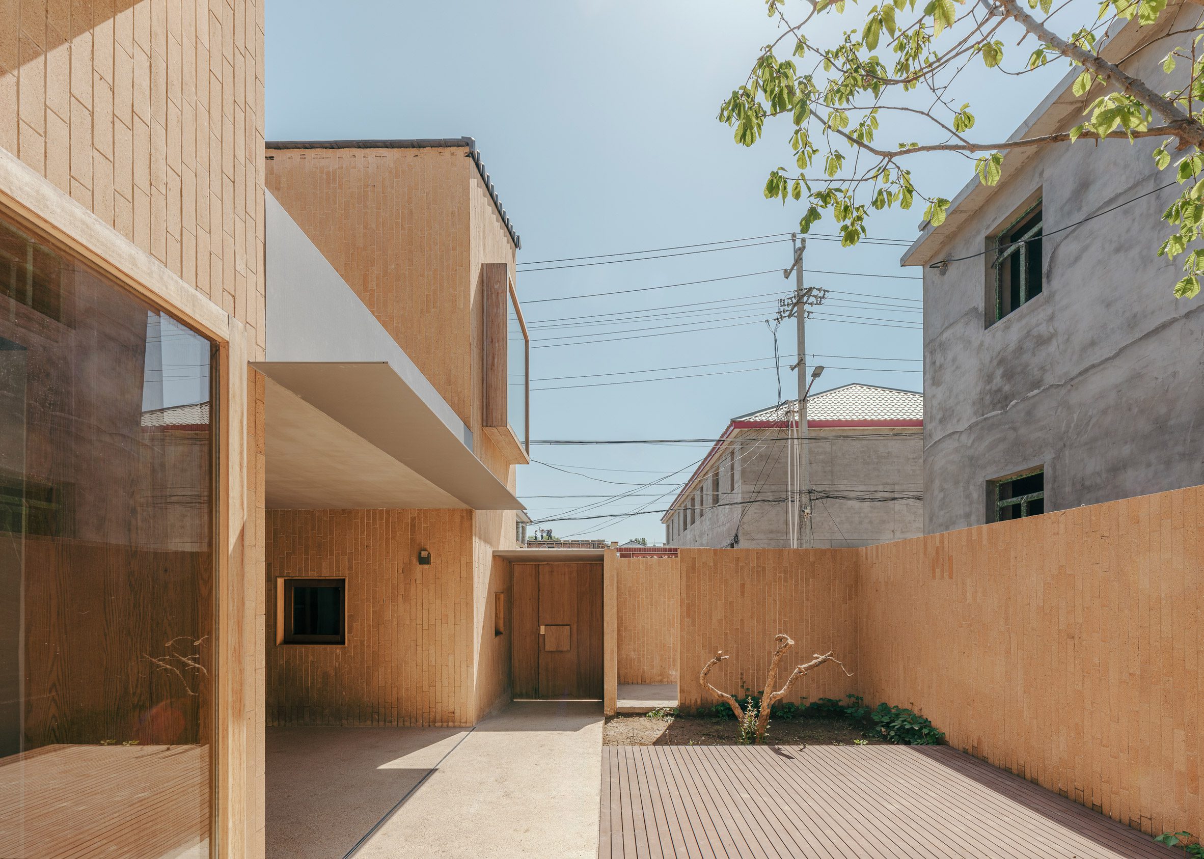 Entrance courtyard within rural home by CPlus Architects