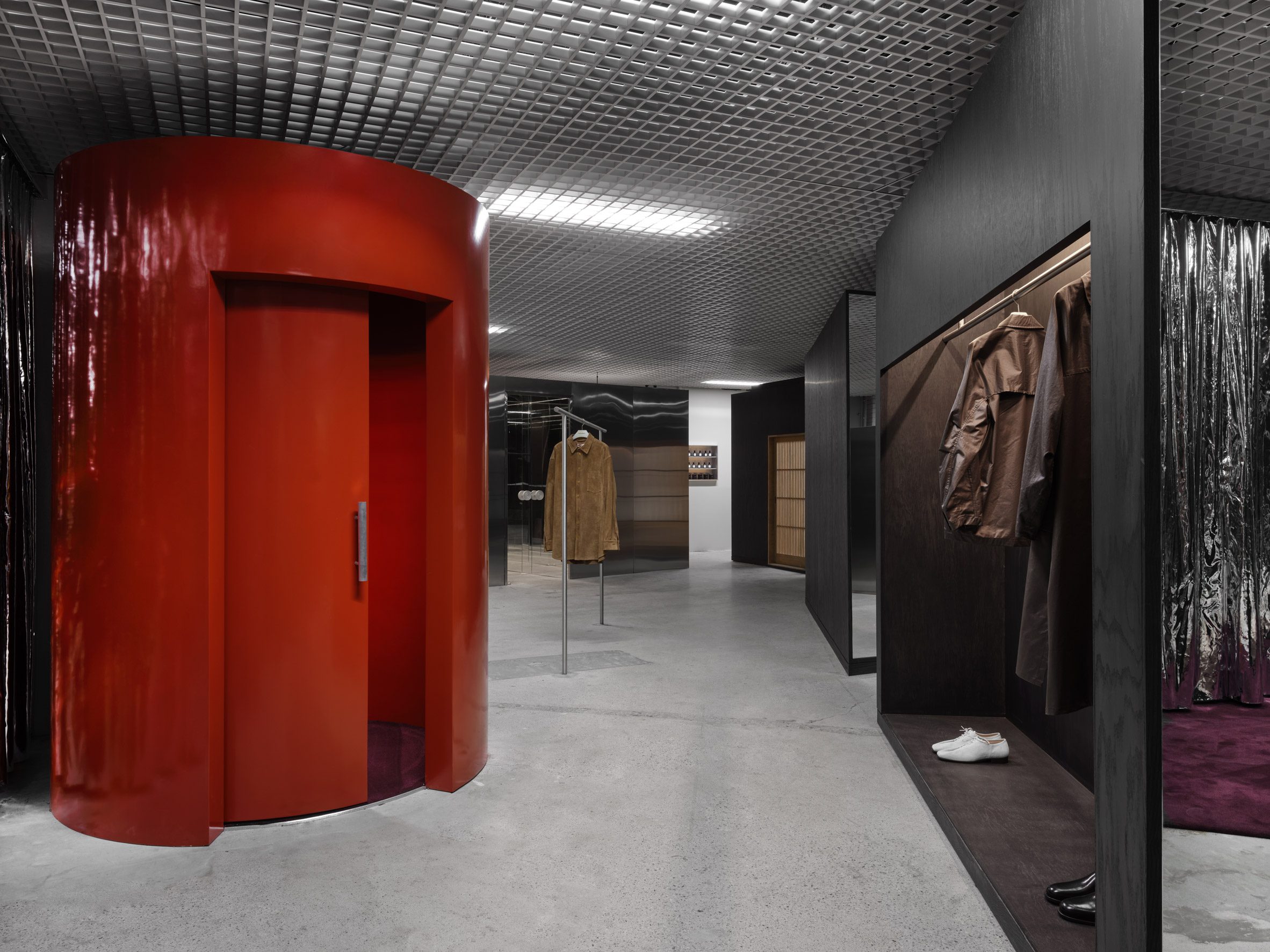 A red cylindrical elements that acts a fitting room