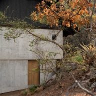 Concrete wall and black roof overhang